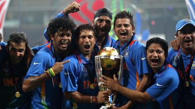 Sreesanth, Sachin Tendulkar, Harbhajan Singh and Suresh Raina celebrate India's 2011 World Cup win in Mumbai. Getty Images