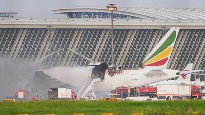 Firefighters at work after an Ethiopian Airlines cargo plane caught fire at Shanghai Pudong International Airport, China. Reuters
