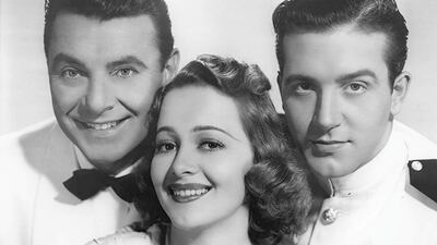 Olivia de Havilland, George Brent and John Payne in 'Wings of the Navy' (1939). IMDb