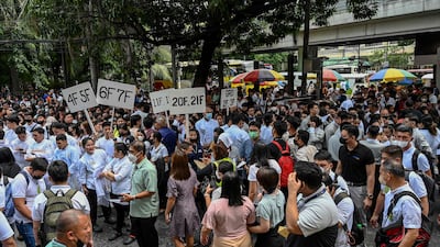 People gather on a street after evacuating a building in Manila, following a magnitude 6. 2 earthquake in the Philippines. AFP