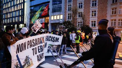 People gather to demonstrate against the arrival of Turkish President Erdogan in Brussels, Belgium. EPA