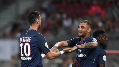 Paris Saint-Germain’s Argentinian midfielder Javier Pastore (L) celebrates with Paris Saint-Germain’s French defender Layvin Kurzawa after scoring during the Trophee des Champions ‘super cup’ match between PSG and Lyon in Klagenfurt, Austria, on August 6, 2016. Boris Horvat / AFP