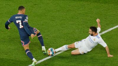 PSG's Kylian Mbappe is tackled by Dani Carvajal. AFP