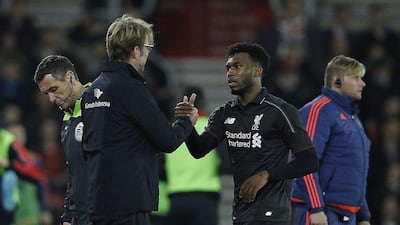 Liverpool manager Jurgen Klopp shakes hands with Daniel Sturridge as the latter left the pitch on Wednesday in his team's League Cup quarter-final victory. Adrian Dennis / AFP / December 2, 2015