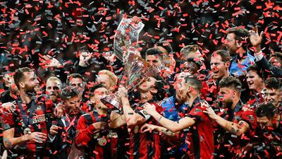Atlanta United captain Michael Parkhurst kisses the trophy. AP Photo