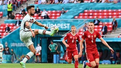Portugal's Bruno Fernandes, left, controls the ball during the Group F match in Hungary. PA