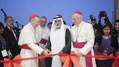 Sheikh Nahyan bin Mubarak, Minister of Youth, Culture and Community Development, is joined by Cardinal Pietro Parolin, left, and Bishop Paul Hinder, right, at the inauguration and blessing of St Paul's Church in Mussaffah on Thursday. Mona Al Marzooqi / The National