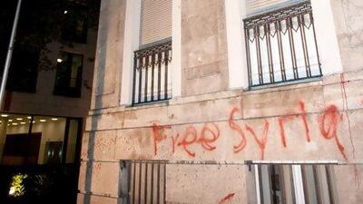 Graffiti on the front of the fully staffed Syrian Embassy in Berlin. Members of the solidarity group Adopt a Revolution claim activists have been beaten up by agents operating from the building. AFP