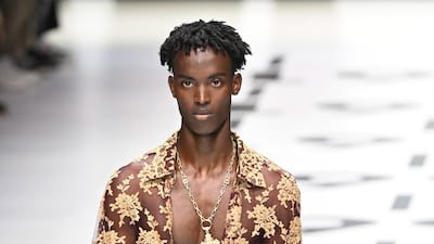 Baggy 1990s-style trousers and lace shirts feature in the Dolce & Gabbana spring/summer 2023 menswear collection. Photo: EPA