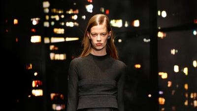 Black magic at Donna Karan. Donna Karan’s love for New York City is a common theme throughout most of her collections. This season she took it further still, by using a night-time skyline of the city as the backdrop to her show. Similar to Stuart Vevers, Karan worked with the idea of New York as a melting pot of different cultures and styles; however the results are strikingly different. With a primarily black palette, the designer sprinkled in some browns, whites and golds into her moody pieces. Perhaps the most significant element was Karan’s effortless layering — button down shirts with velvet, silk-lined jackets and voluminous wool and jacquard coats, all cinched at the waist with glossy leather belts. Even the hems of jumpers and skirts were layered with intricate pleats and folds. JP Yim / Getty Images for Mercedes-Benz Fashion Week / AFP