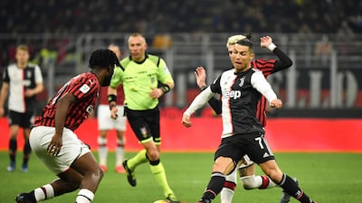 Cristiano Ronaldo runs at the Milan defence. AP