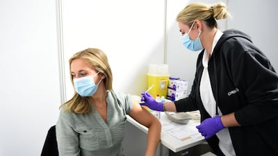 A doctor vaccinates an employee with the Pfizer BioNTech vaccine at the vaccination centre of CHEMPARK operator CURRENTA in Leverkusen, western Germany, on June 22 2021. AFP