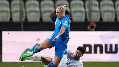 Iceland's Arnor Sigurdsson is tackled by Israel's Roy Revivo during the Euro 2024 qualifying play-off match. AP