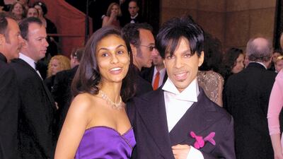 2004: Eternally, effortlessly cool in purple with a statement collar, Prince at the 76th Annual Academy Awards on February 29, 2004. Wire Image
