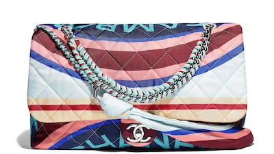 Chanel: Wrapping a giant logo around a softly quilted bag makes it bold and jaunty. Ribbons of coloured leather running through the strap round off the look.