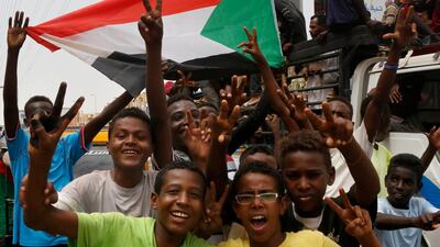 Sudanese protesters celebrate in the streets of Khartoum after ruling generals and protest leaders announced they have reached an agreement. AFP