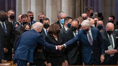 US President Joe Biden greets former president Bill Clinton at the funeral. EPA