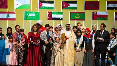 Sheikh Mohammed bin Rashid with the grand winner Maryam Amjoun of Morocco. Leslie Pableo for The National
