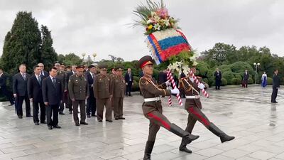 Mr Shoigu attends a wreath-laying ceremony at the Liberation Monument in Pyongyang. EPA
