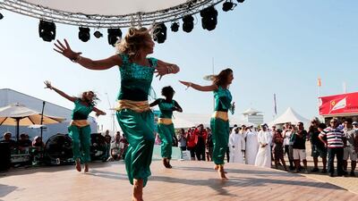 Dancers perform in the Fan Zone behind the main grandstand. Christopher Pike / The National