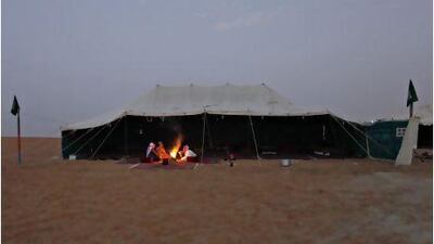 Saleh Al Dossary at his camp with relatives and friends at Al Dhafra Festival. Jeff Topping / The National