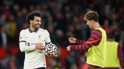 Liverpool hat-trick scorer Mohamed Salah celebrates with the match ball after the final whistle. AP