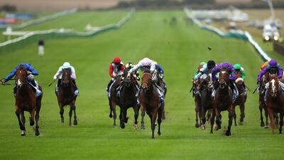 Tomfre, ridden by Harry Bentley (centre), clinched The Dubai Nursery at Newmarket. Press Association