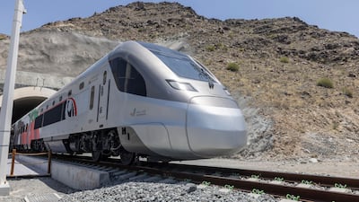 A Etihad Rail passenger train arrives in the mountain village of Al Bitnah, Fujairah. Antonie Robertson / The National