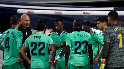 Real Madrid's French coach Zinedine Zidane talks to his players during La Liga match against Leganes. AFP