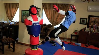 Hedaya Malak Wahba, Egyptian Taekwondo practitioner and 2016 Rio Olympics bronze medallist, works out at her home as she trains for the postponed Tokyo Olympic Games, in Cairo, Egypt. Reuters