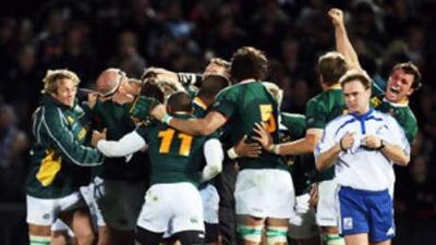 The Springboks celebrate their first ever win over the All Blacks at Carisbrook after the final whistle in the 2008 Tri Nations series match.