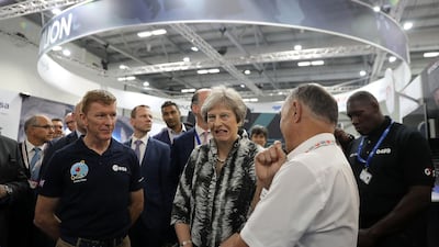 British astronaut Tim Peake (L) speaks with UK Prime Minister Theresa May at Farnborough. The UK will build its first spaceport in Scotland. Getty