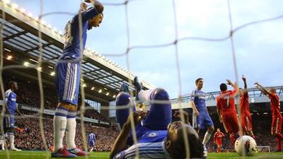LIVERPOOL, ENGLAND - MAY 08: Ryan Bertrand () of Chelsea shows his frustration as Daniel Agger of Liverpool celebrates scoring their third goal with Luis Suarez and Martin Skrtel of Liverpool during the Barclays Premier League match between Liverpool and Chelsea at Anfield on May 8, 2012 in Liverpool, England. (Photo by Alex Livesey/Getty Images)