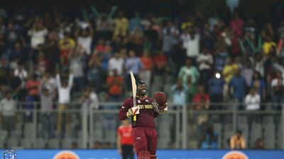 West Indies cricketer Chris Gayle celebrates scoring his century against England at the World T20. Danish Siddiqui /Reuters / March 16, 2016