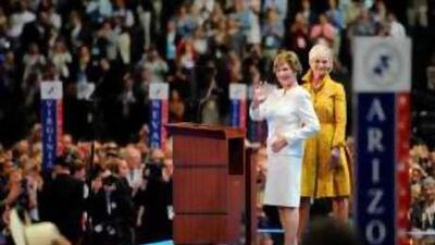 Laura Bush, left, and Cindy McCain, wife of the Republican presidential candidate John McCain, acknowledge the crowds at the Republican convention.