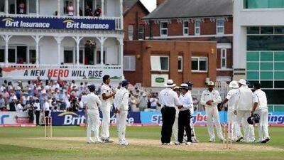 The umpires double-checked with the India captain MS Dhoni, behind umpire Asad Rauf, centre, and Marais Erasmus, to ensure if he still wanted to call for the run out. But when an attempt to reverse it emerged, both umpires stepped away from the spotlight and let common sense prevail.