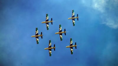 The Al Fursan National Aerobatic Team perform a fly-by. EPA