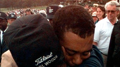 Tiger Woods hugs his his father, Earl, after winning the 1997 Masters. AP Photo