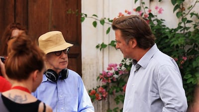 Director Woody Allen and Alec Baldwin speak during the filming of 'To Rome With Love' (2012) at Piazza Madonna Dei Monti. Getty