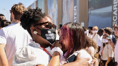 Activists embrace in Sharm El Sheikh. Reuters