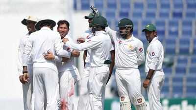 Yasir Shah, third left, did most of the damage to the West Indies batting lineup with 10 wickets in the match. Tom Dulat / Getty Images