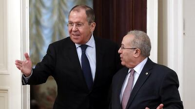 Russian Foreign Minister Sergei Lavrov and Algerian Deputy Prime Minister and Foreign Minister Ramtane Lamamra enter a hall during their meeting in Moscow. EPA