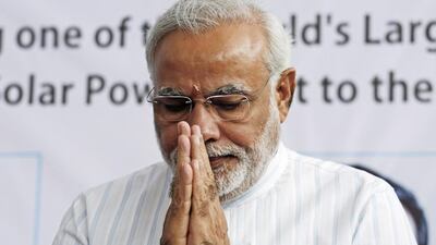 Narendra Modi greets the media at a press conference near Bhagwanpura, Madhya Pradesh, last month. Vivek Prakash / Bloomberg News