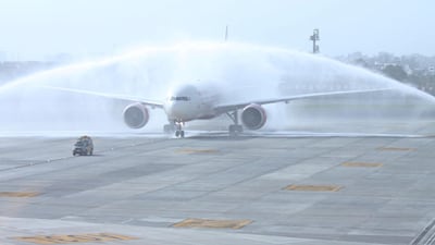 Water salutes like this Air India flight at Indira Gandhi International airport are commonly used to mark the opening of new routes or special occasions. Barcroft India / Getty Images