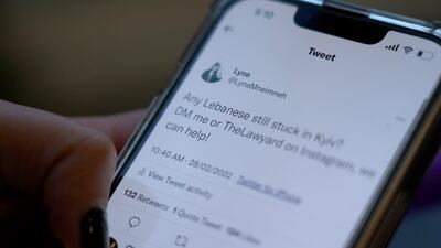 Lyne Mneimneh checks the responses to a tweet she posted offering help to Lebanese nationals stuck in Kyiv.