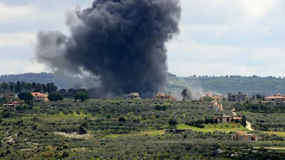 Smoke billows after an Israeli strike on the southern Lebanese border village of Tayr Harfa on April 6. AFP