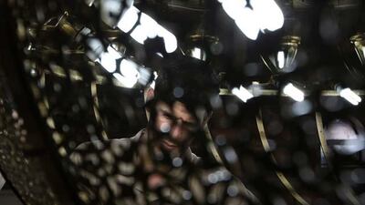 Workers fix parts of the chandelier at the under construction Farooq Mosque in Al Safa area in Dubai.