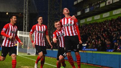 Ryan Bertrand, right, celebrates after scoring for Southampton in a Premier League match in December. Christopher Lee / Getty Images