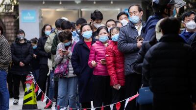 People line up at a nucleic acid testing site outside a hospital during a mass testing for the coronavirus disease (COVID-19), following the outbreak in Shanghai. Reuters