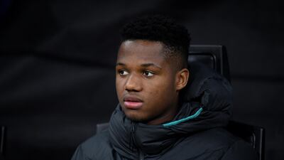 Barca's Fati on the bech before his late impact. Reuters